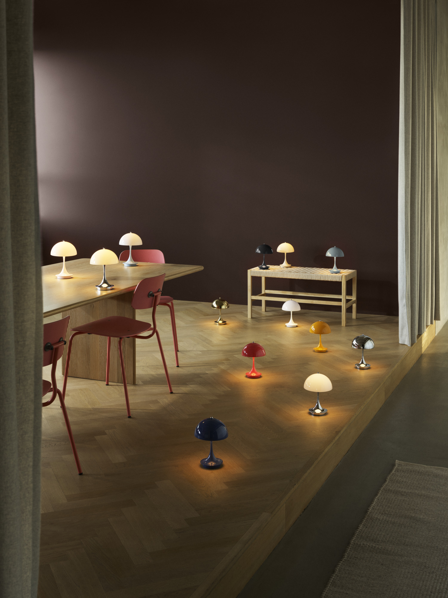 Multiple Panthella 160 table lamps arranged in living room interior, © 2026 Louis Poulsen.