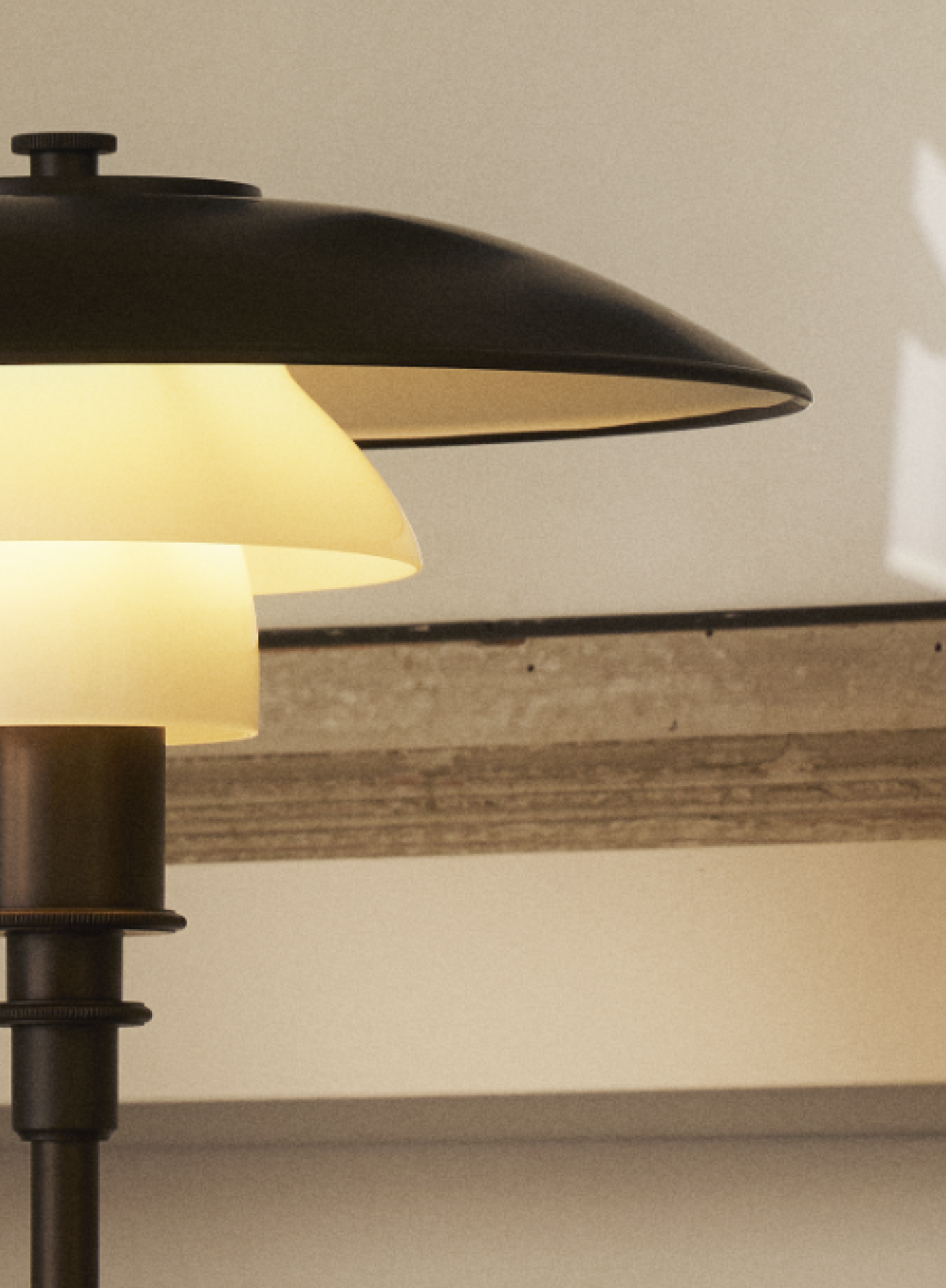 PH 3/2 Aged Brass table lamp with layered shade design in a contemporary space, © 2025 Louis Poulsen.