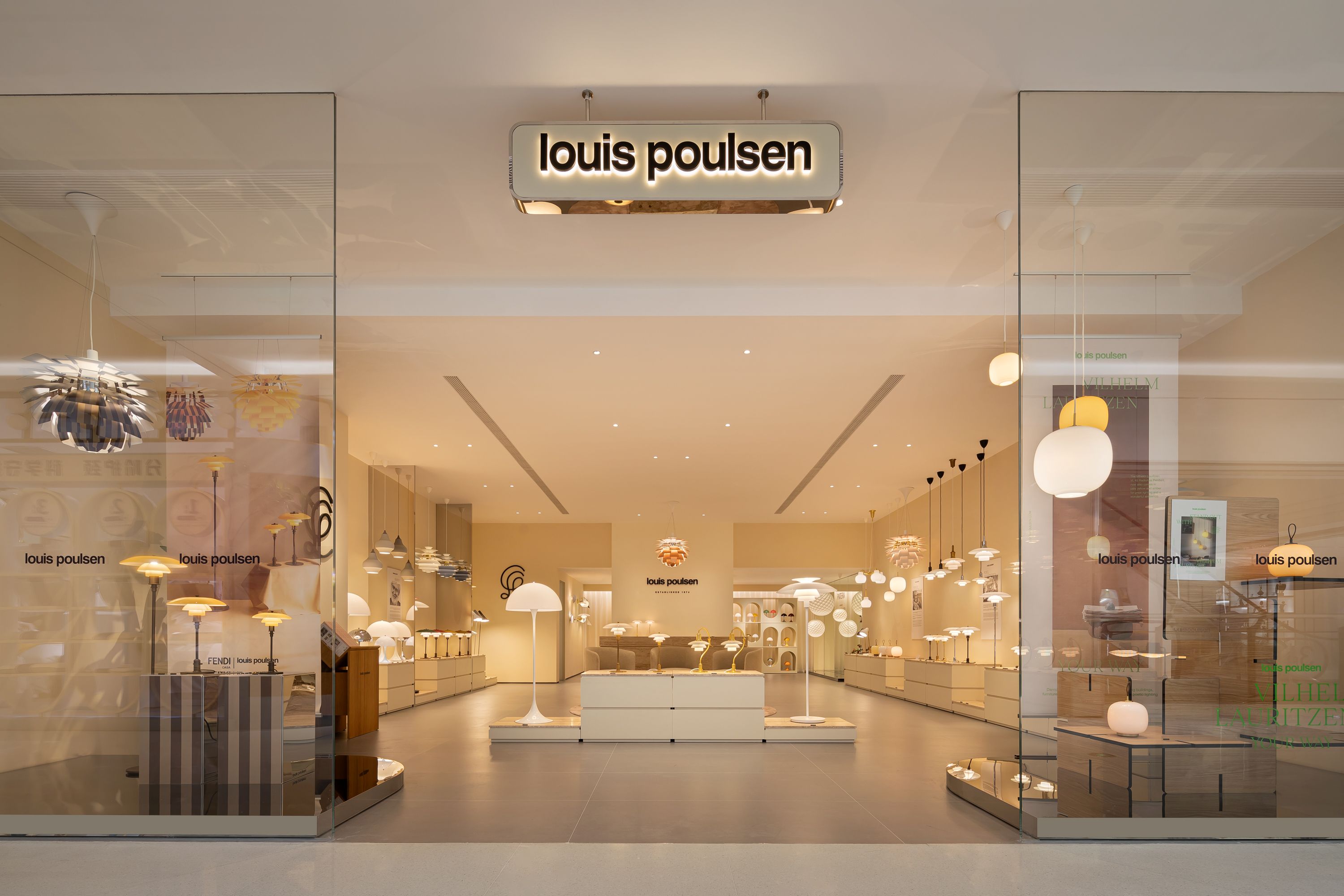 Exterior view of the Louis Poulsen store at Hangzhou Tower in China showcasing lighting displays, © 2025 Louis Poulsen.