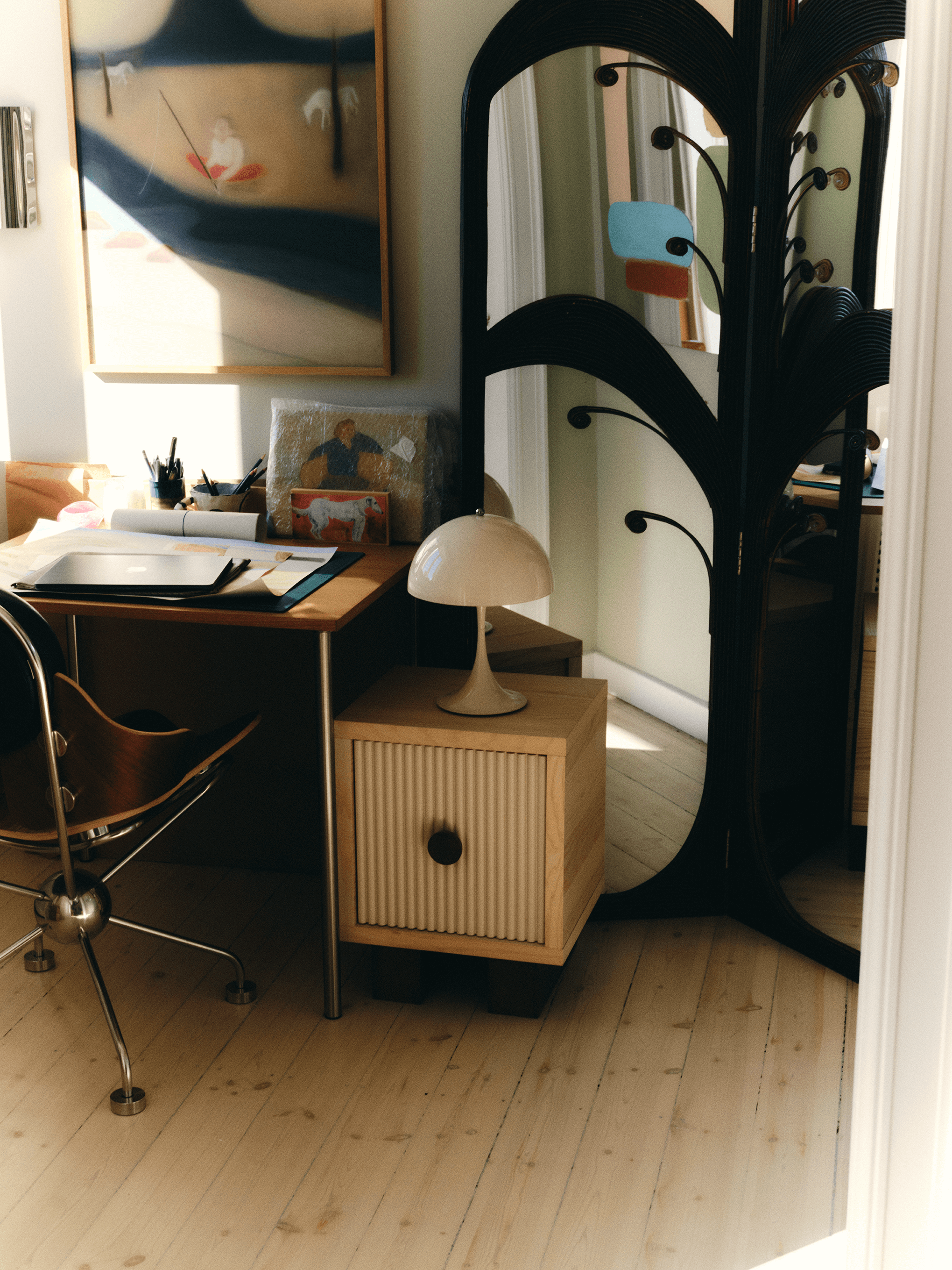 Panthella Table Lamp on side cabinet beside home workspace and mirror, © 2025 Louis Poulsen.